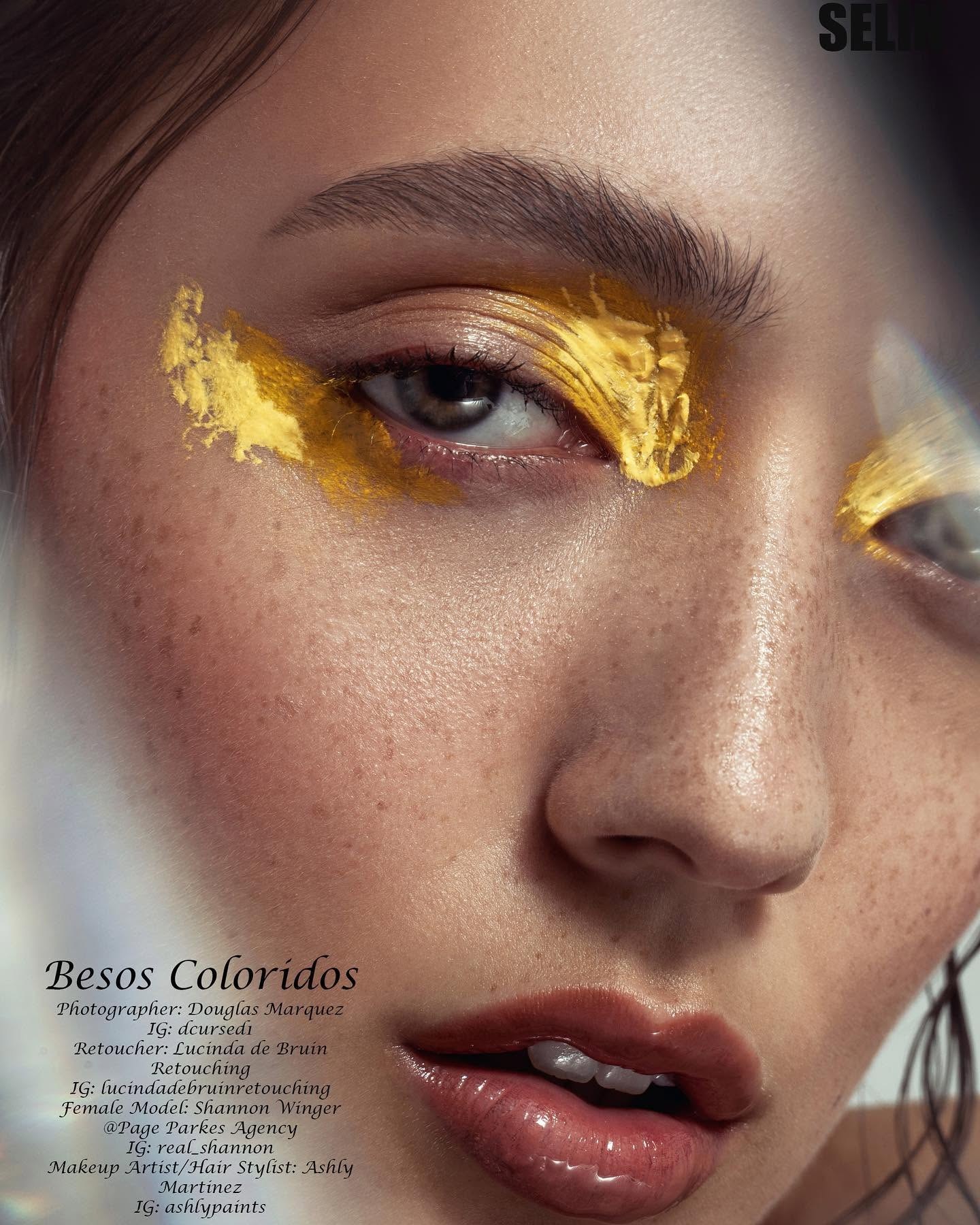 Close beauty portrait with expressive gold eye makeup
