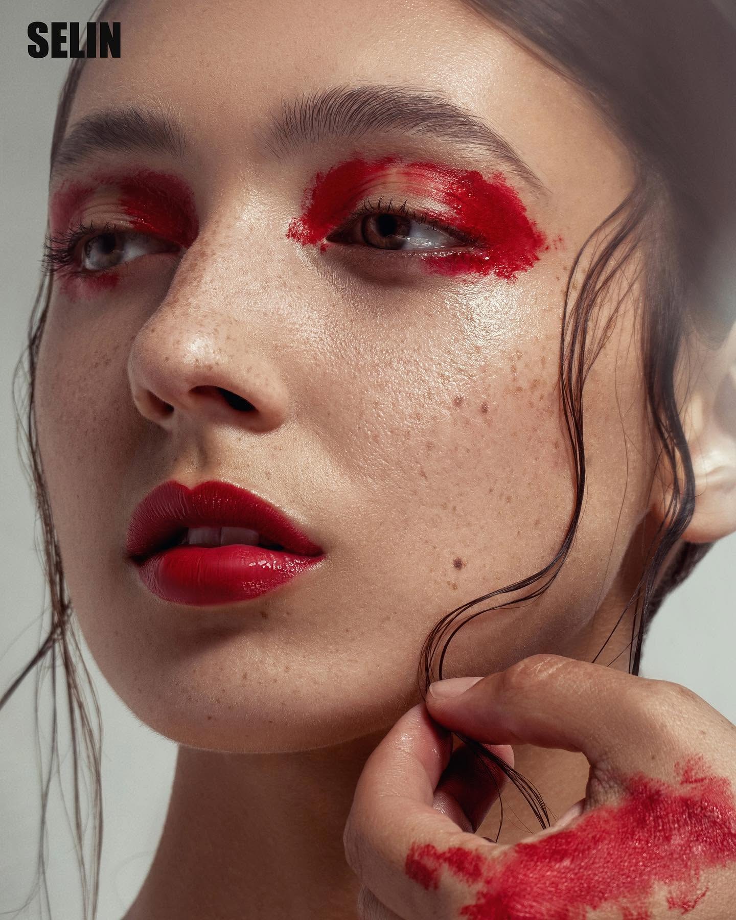 Close beauty portrait with expressive red makeup
