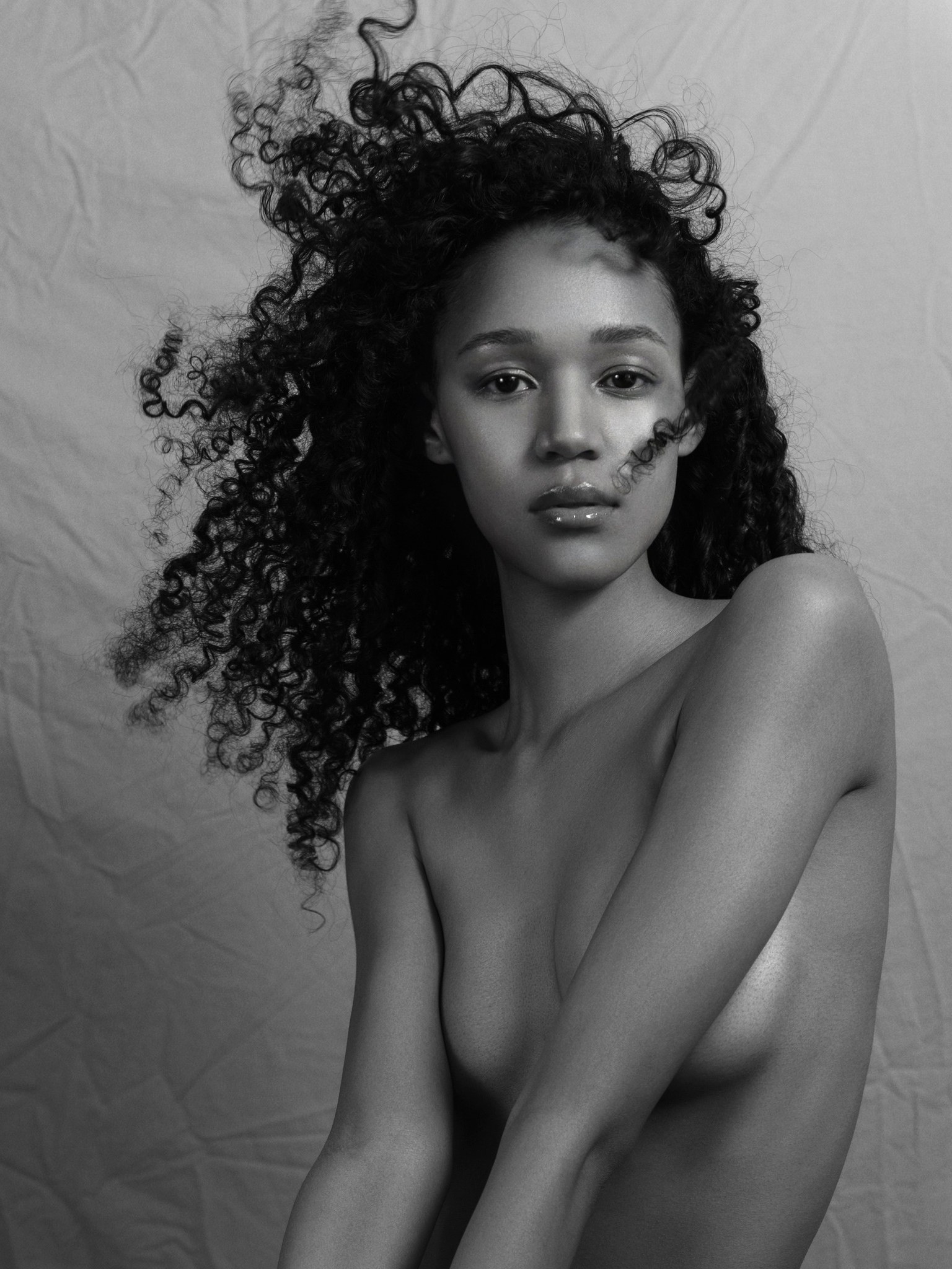 Black-and-white beauty portrait with natural curls