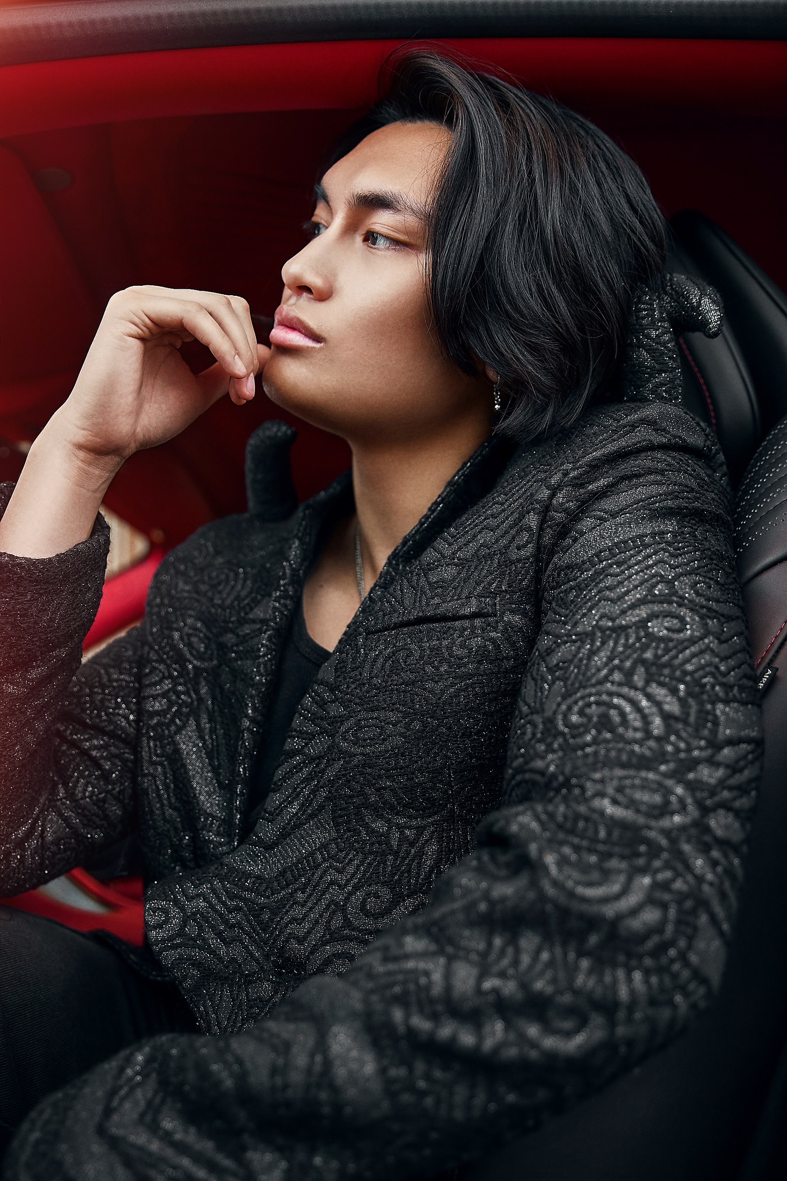 Fashion portrait in a deep red interior