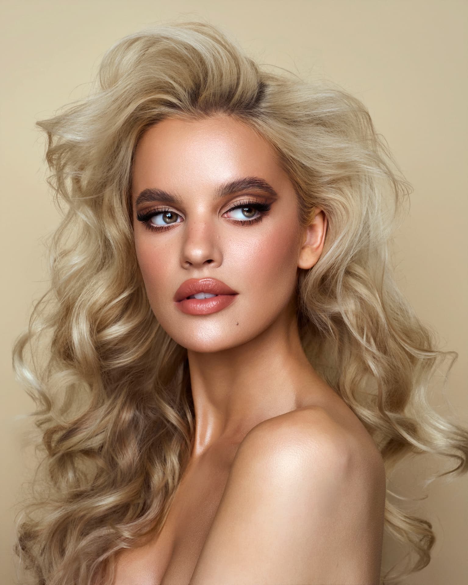Editorial blonde beauty portrait with softly styled hair